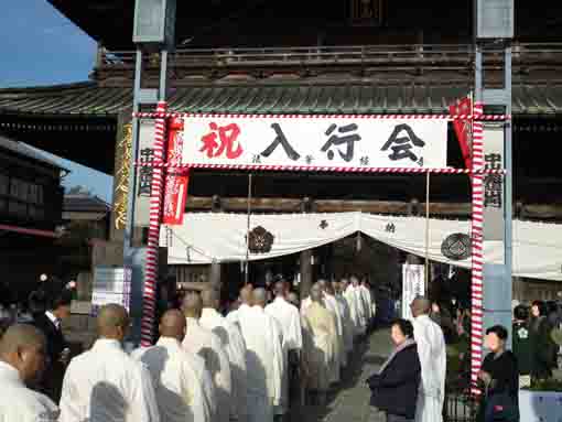 over 100 priests pass the niomon gate