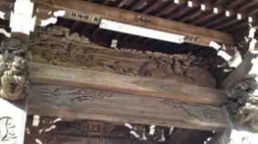 relief on beam of the temple gate